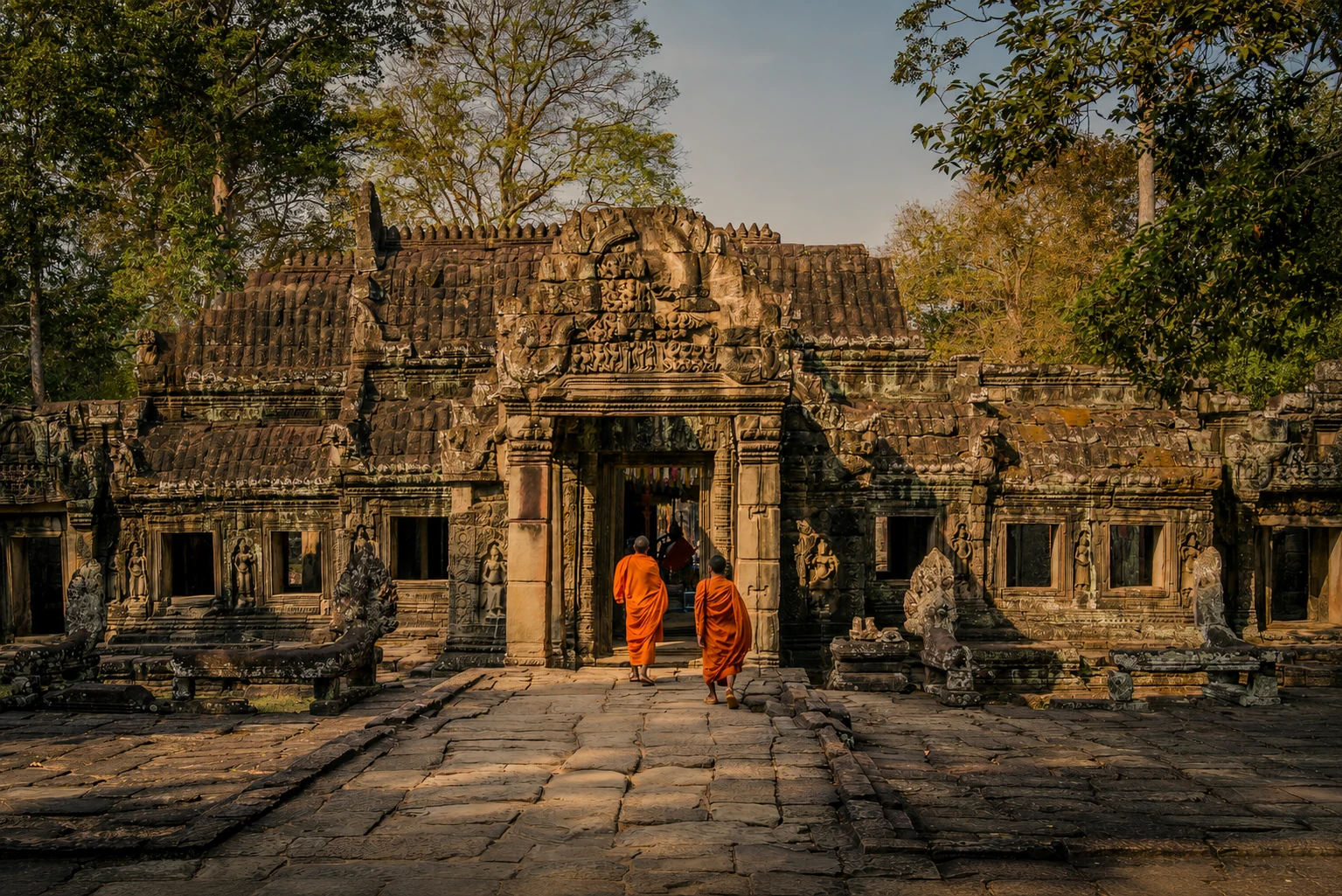 Buddhist monks walking into an Angkor temple